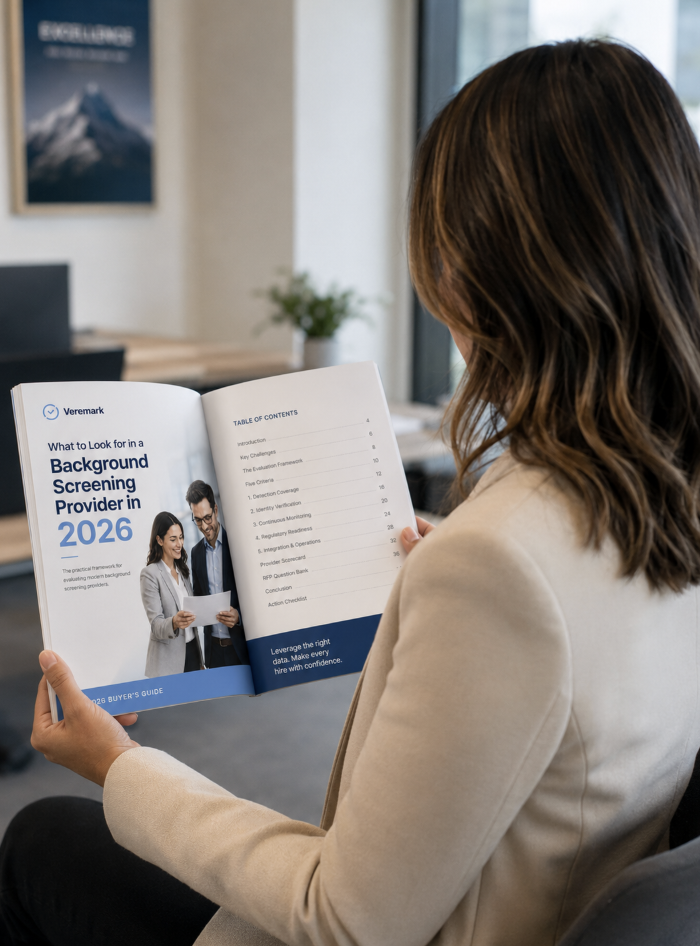 HR professional reviewing the 2026 Background Screening Buyer's Guide